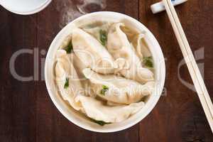 Top view Asian cuisine dumplings soup