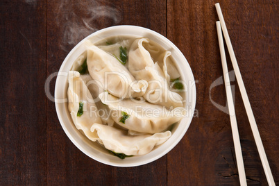 Top view Asian meal dumplings soup