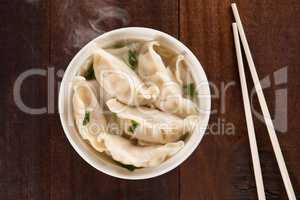Top view Asian meal dumplings soup