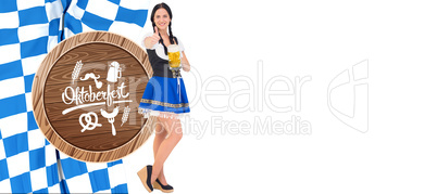 Composite image of pretty oktoberfest girl holding beer tankard