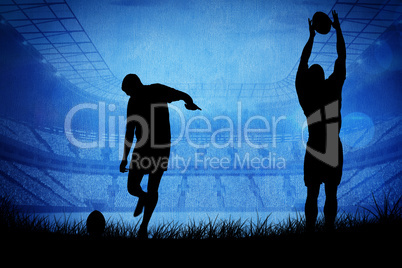 Composite image of silhouette of rugby player