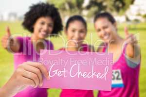 Get checked against three smiling runners supporting breast canc