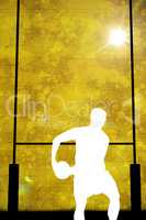 Composite image of silhouette of rugby player