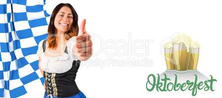 Composite image of pretty oktoberfest girl showing thumbs up