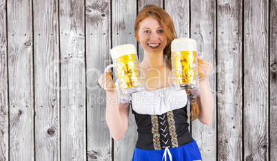 Composite image of oktoberfest girl holding jugs of beer