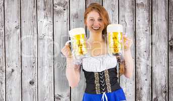 Composite image of oktoberfest girl holding jugs of beer