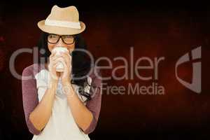 Composite image of brunette with disposable cup