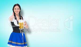 Composite image of pretty oktoberfest girl holding beer tankard