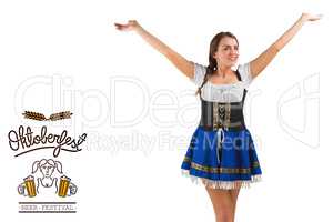 Composite image of pretty oktoberfest girl smiling with arms rai