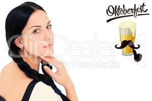 Composite image of pretty oktoberfest girl smiling at camera