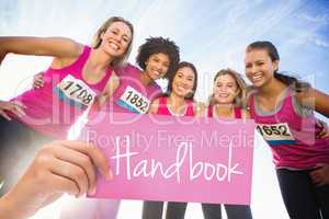 Handbook against five smiling runners supporting breast cancer m