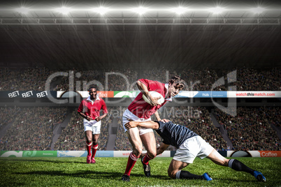 Composite image of rugby fans in arena