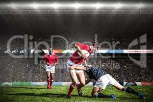 Composite image of rugby fans in arena