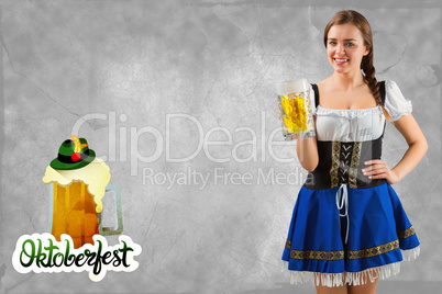 Composite image of pretty oktoberfest girl smiling at camera hol