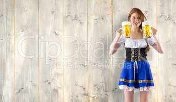 Composite image of oktoberfest girl holding jugs of beer