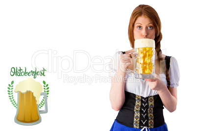 Composite image of oktoberfest girl drinking jug of beer