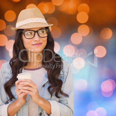 Composite image of brunette with disposable cup