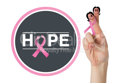 Composite image of crossed fingers with breast cancer ribbon