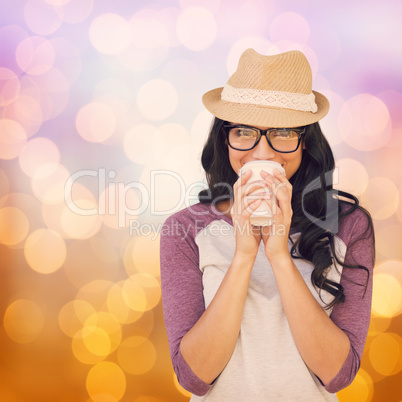 Composite image of brunette with disposable cup