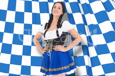 Composite image of pretty oktoberfest girl smiling at camera