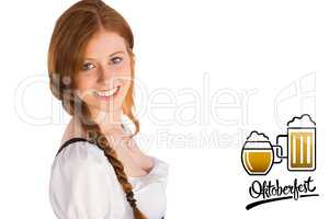 Composite image of oktoberfest girl smiling at camera