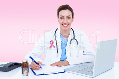 Composite image of portrait of smiling female doctor writing on