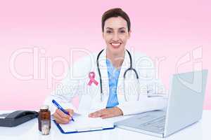 Composite image of portrait of smiling female doctor writing on