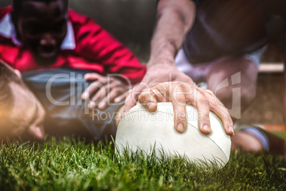 Composite image of rugby fans in arena