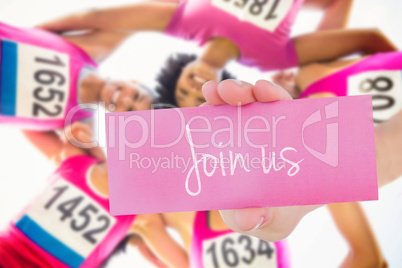 Join us against five smiling runners supporting breast cancer ma
