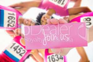 Join us against five smiling runners supporting breast cancer ma