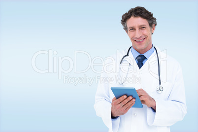 Composite image of portrait of smiling male doctor holding digit