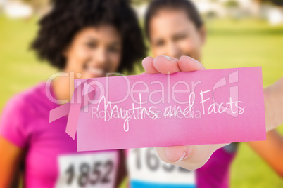 Myths and facts against two smiling runners supporting breast ca