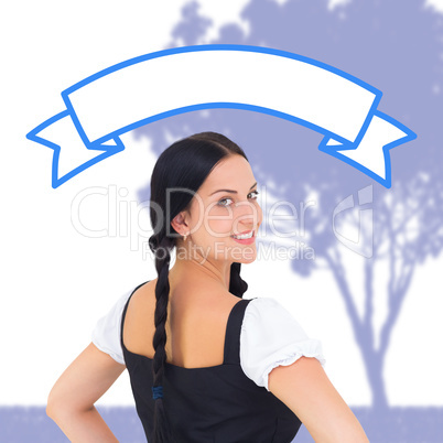 Composite image of pretty oktoberfest girl smiling at camera