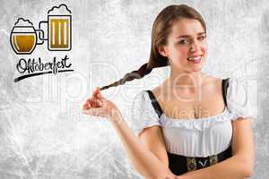 Composite image of pretty oktoberfest girl smiling at camera