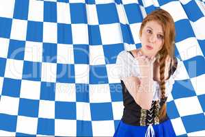 Composite image of oktoberfest girl blowing a kiss
