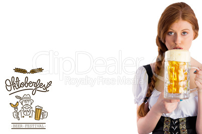 Composite image of oktoberfest girl drinking jug of beer