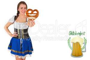 Composite image of pretty oktoberfest girl holding pretzel