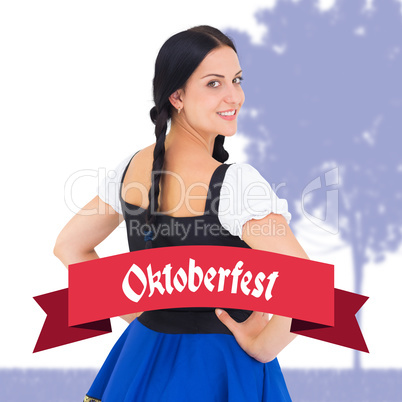 Composite image of pretty oktoberfest girl smiling at camera