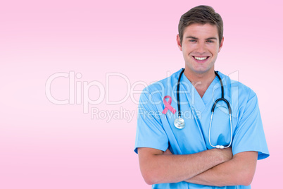 Composite image of young nurse in blue tunic with arms crossed