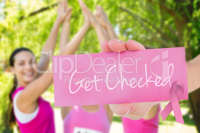 Get checked against smiling women running for breast cancer awar