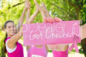 Get checked against smiling women running for breast cancer awar
