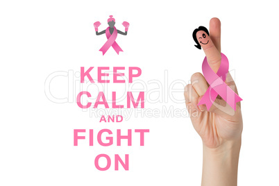 Composite image of crossed fingers with breast cancer ribbon