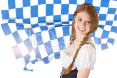 Composite image of oktoberfest girl smiling at camera