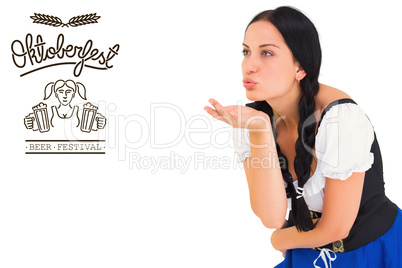 Composite image of pretty oktoberfest girl blowing a kiss