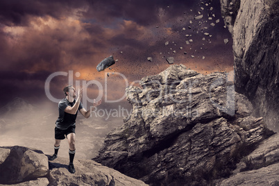 Composite image of rugby player catching the ball