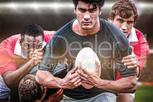 Composite image of rugby fans in arena