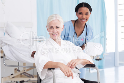 Composite image of portrait of smiling nurse with female patient