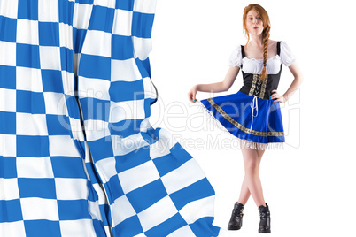 Composite image of oktoberfest girl spreading her skirt