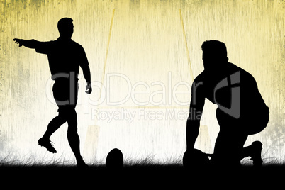 Composite image of silhouette of rugby player