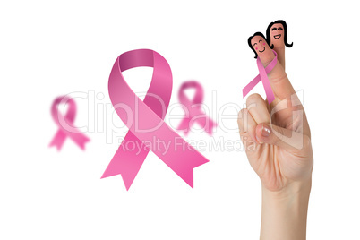 Composite image of crossed fingers with breast cancer ribbon